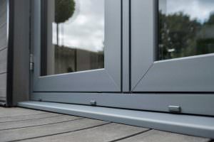 Bottom rail of anthracite grey flush french doors