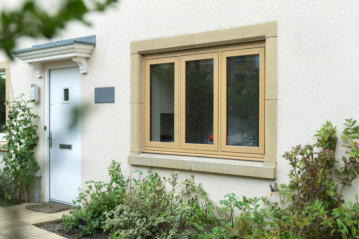 uPVC woodgrain foil flush sash windows on a traditional style home